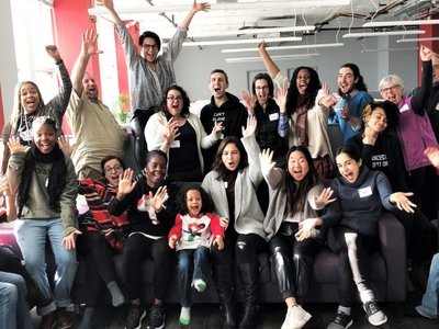 Staff jumping with joy in a room