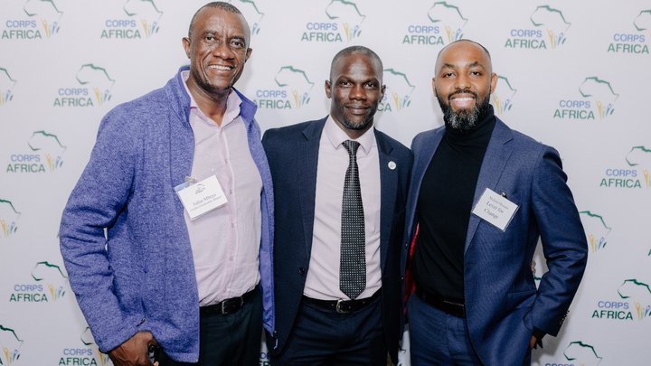 Photo of Muhsin Hassan and two attendees posing for a photo at CorpsAfrica's 2024 UNGA Reception